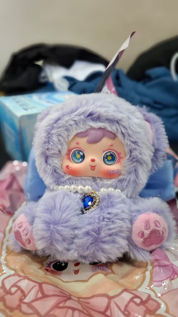 Samuel Purple with Pearls (Category: Plushies & Soft Toys) located in Manila. Submitted by jonelllliiii (Listing ID 1462982773, Image 3). Description: - Super soft purple plush toy - Big, expressive eyes - Fluffy hood - Decorated with a string of pearls - Sparkly blue gem on the chest - Pink paws - Very cuddly and adorable - Great for collectors or as a cute gift.