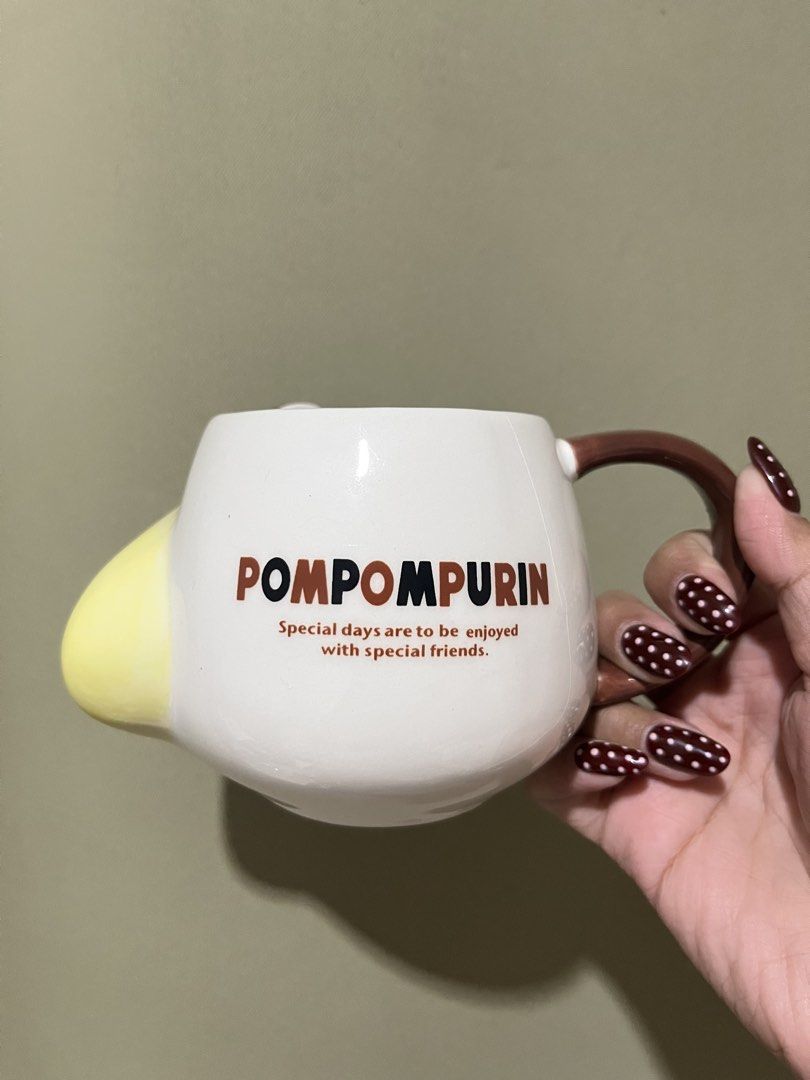 Sanrio Pompompurin Mug Special Friends (Category: Coffee & Tea Tableware) located in Manila. Submitted by vaughnscloset (Listing ID 1463045085, Image 2). Description: - Adorable Pompompurin mug featuring his signature hat. - Sweet message: 'Special days are to be enjoyed with special friends.' - Classic white ceramic with charming brown handle and details. - Ideal for your daily coffee or tea. - A must-have for any Sanrio enthusiast!.
