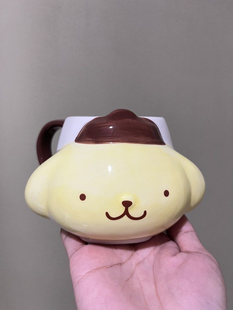 Sanrio Pompompurin Mug Special Friends (Category: Coffee & Tea Tableware) located in Manila. Submitted by vaughnscloset (Listing ID 1463045085, Image 1). Description: - Adorable Pompompurin mug featuring his signature hat. - Sweet message: 'Special days are to be enjoyed with special friends.' - Classic white ceramic with charming brown handle and details. - Ideal for your daily coffee or tea. - A must-have for any Sanrio enthusiast!.