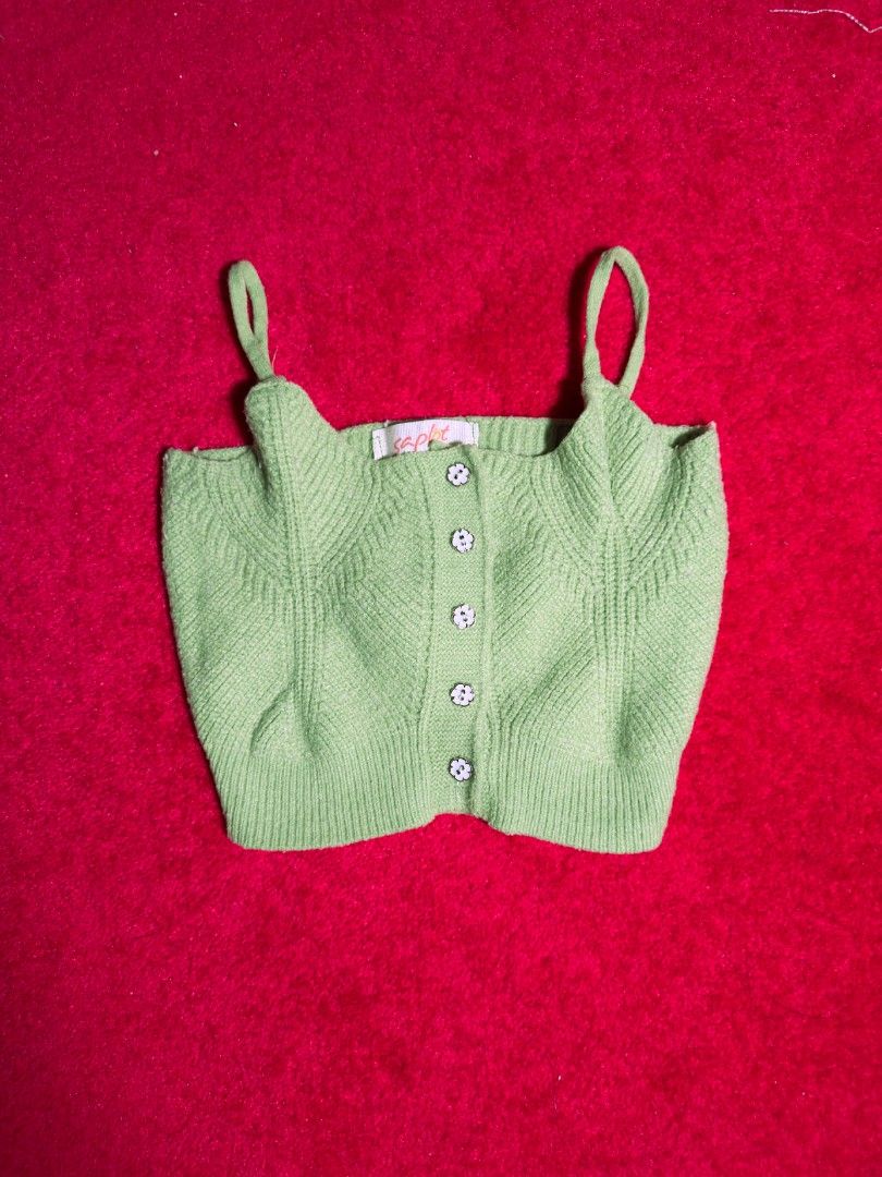 Saplot Knitted Mini Top (Category: Sleeveless) located in Makati City. Submitted by ydeolch (Listing ID 1463069885, Image 1). Description: Soft sage green, sweetly detailed, and effortlessly cute 🌿 ✿ Size: Small (S) ✿ Condition: Like new ✿ Color: Green ✿ Ribbed knit fabric with a soft, textured finish ✿ Spaghetti straps ✿ Button-front closure with cute floral buttons ✿ Fitted silhouette with a comfortable stretch 💌 Message me for measurements �