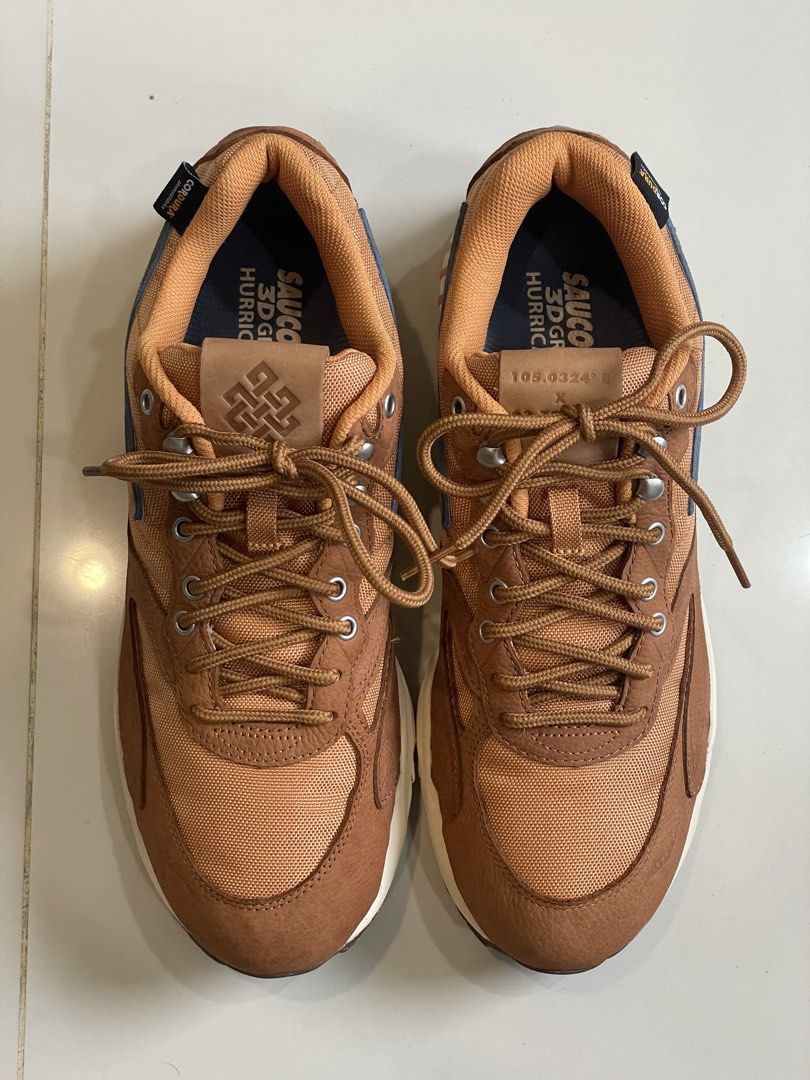 Saucony 3D Grid Hurricane (Category: Sneakers) located in Consolacion. Submitted by pau.magpantay (Listing ID 1462886226, Image 1). Description: Saucony 3D Grid Hurricane sneakers in brown. - Size US 11 / UK 10 / EUR 45 / CM 29. - With box.