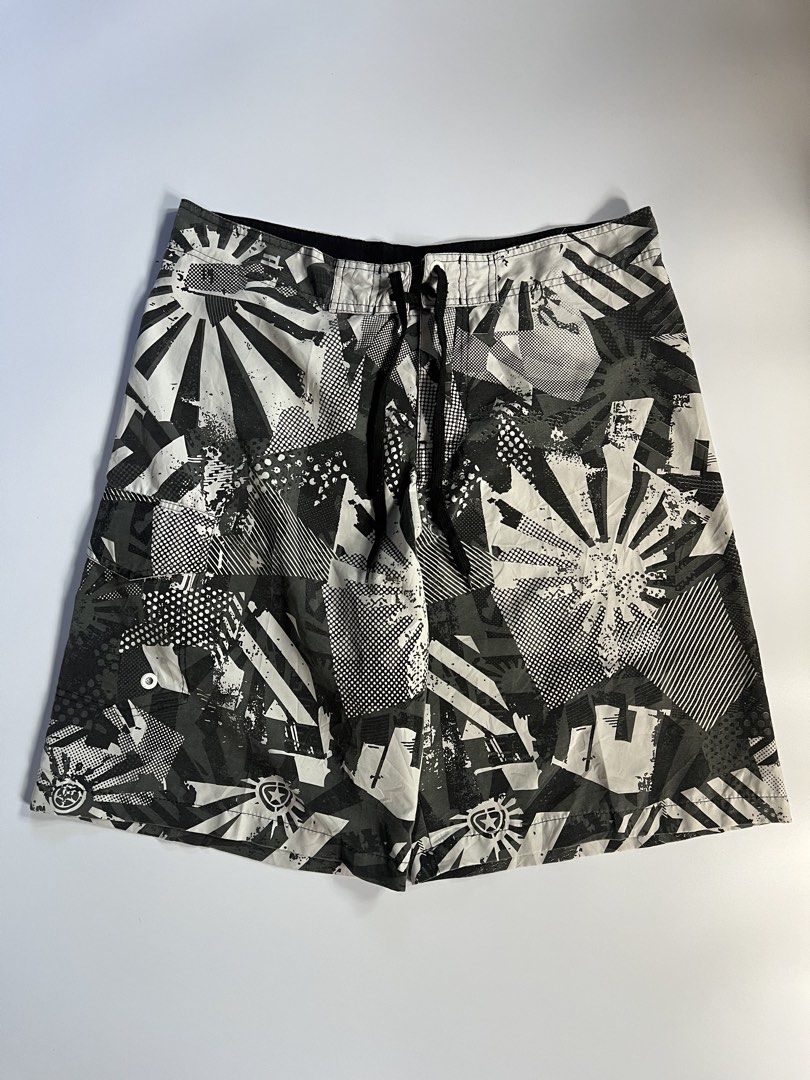 Sean John Board Shorts Size 38 Abstract Print (Category: Shorts) located in Baler. Submitted by allthrifted31 (Listing ID 1462963365, Image 1). Description: - Sean John board shorts - Size: 38 - Color: Black, white, and grey abstract print - Features: Drawstring waist, one back pocket with button closure - Ideal for: Swimming or lounging.