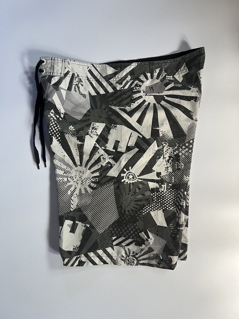 Sean John Board Shorts Size 38 Abstract Print (Category: Shorts) located in Baler. Submitted by allthrifted31 (Listing ID 1462963365, Image 3). Description: - Sean John board shorts - Size: 38 - Color: Black, white, and grey abstract print - Features: Drawstring waist, one back pocket with button closure - Ideal for: Swimming or lounging.