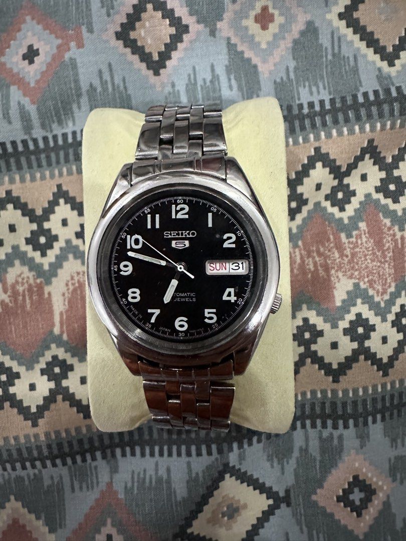 Seiko 5 Automatic Watch (Category: Men's Watches) located in Mandaue City. Submitted by alexdelmar22310 (Listing ID 1463042799, Image 1). Description: - Seiko 5 Automatic Watch - Classic black dial - Convenient day and date display - Durable stainless steel band - Authentic Made in Japan quality - Excellent running condition - Case Size: 37mm - Watch Only - Guaranteed Authentic - Price is Slightly Negotiable - Reason For Sale: Rarely used & Declu
