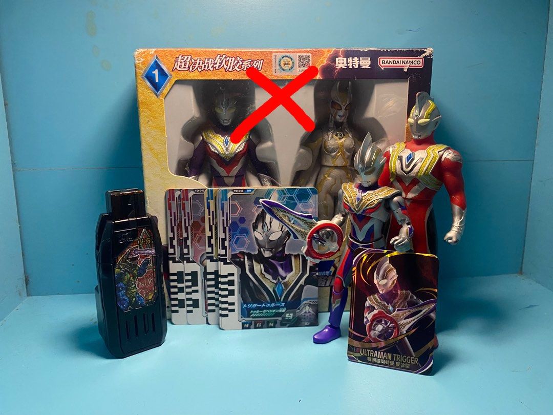 set ultraman trigger (Category: Action & Battle Toys) located in Kuala Lumpur. Submitted by hakeefhadafee (Listing ID 1450096721, Image 1). Description: - Set of Ultraman toys including Ultraman Trigger figures. - Comes with a DX Geed Riser. - Includes various collectible Ultraman cards. - Some Ultraman Trigger figures are still in their original boxes. - All items are clearly shown in the provided photos. - Ideal gift for any Ultraman enthusiast