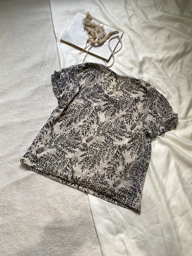 Sheer Leaf Print Puff Sleeve Top Small 34 (Category: Blouses) located in Poro. Submitted by joyceyuu (Listing ID 1462924011, Image 3). Description: - Lightweight sheer fabric - Delicate leaf print - Gathered detailing at the bust - Short puff sleeves - Subtle textured trim neckline - Versatile for layering or wearing on its own - Easy to style for casual or dressier occasions.
