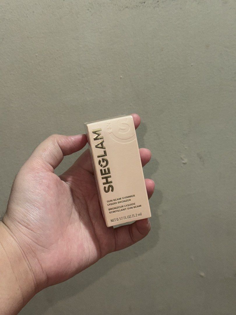 SHEGLAM Sun Beam Shimmer Liquid Bronzer in Toffee (Category: Makeup) located in Manila. Submitted by thatprelovedshop (Listing ID 1462930744, Image 1). Description: - SHEGLAM Sun Beam Shimmer Liquid Bronzer in Toffee - SEALED and BRAND NEW - RFS: I was supposed to buy the shade Terracotta..