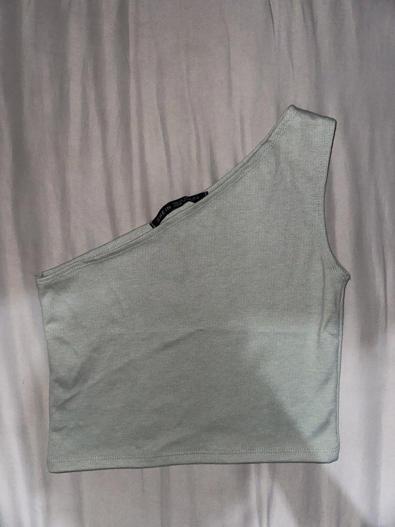 SHEIN One Shoulder Ribbed Crop Top (Category: Sleeveless) located in Manila. Submitted by etain.xo (Listing ID 1463023600, Image 1). Description: - Light green one-shoulder crop top from SHEIN - Ribbed material for a comfortable and stretchy fit - Versatile piece, pairs well with high-waisted jeans or skirts - Simple and chic design -Fits small to medium.