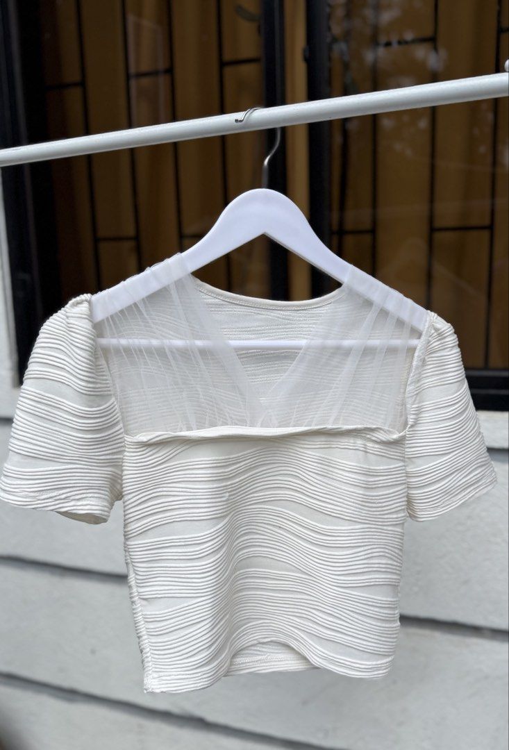 SHEIN White Textured Mesh Crop Top (Category: Blouses) located in Manila. Submitted by mcpascua (Listing ID 1462958168, Image 1). Description: - White crop top from SHEIN - Textured fabric all over - Mesh detail on neckline and shoulders - Short sleeves - Versatile styling: tuck into high-waisted jeans or skirts - Ideal for casual outings or nights with friends.