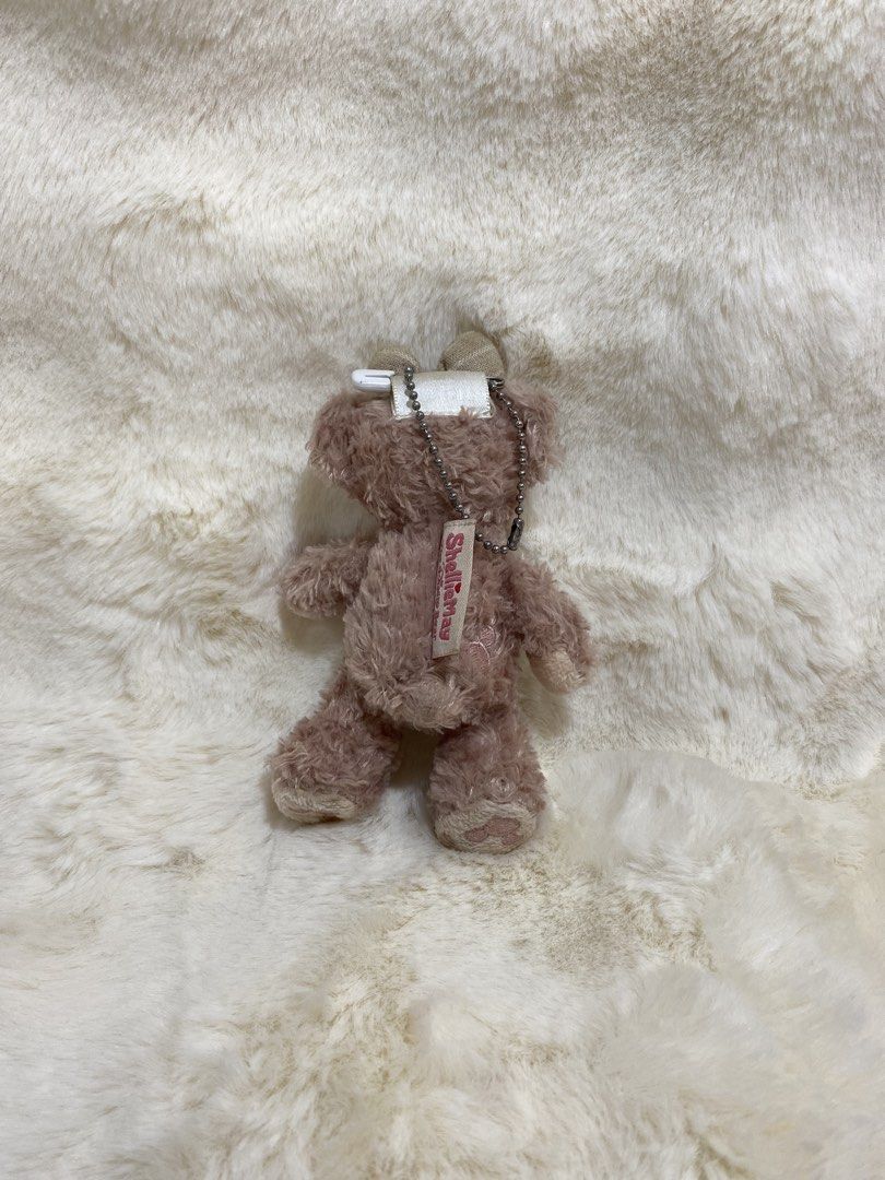 ShellieMay Bear Plush charm (Category: Plushies & Soft Toys) located in Kalibo. Submitted by ollie_stuffshop (Listing ID 1462899107, Image 2). Description: Before you send your inquiries: ❗️Last Price is already posted ❗️Manage your expectations, WYSIWYG ❗️May need washing ❗️Dropoff is every Wednesday & Sunday - Adorable dusty pink bear plush toy - Features a cute bow on its head - Tag reads 'Sheeplana' - Soft and huggable fur - Approximately 5 i