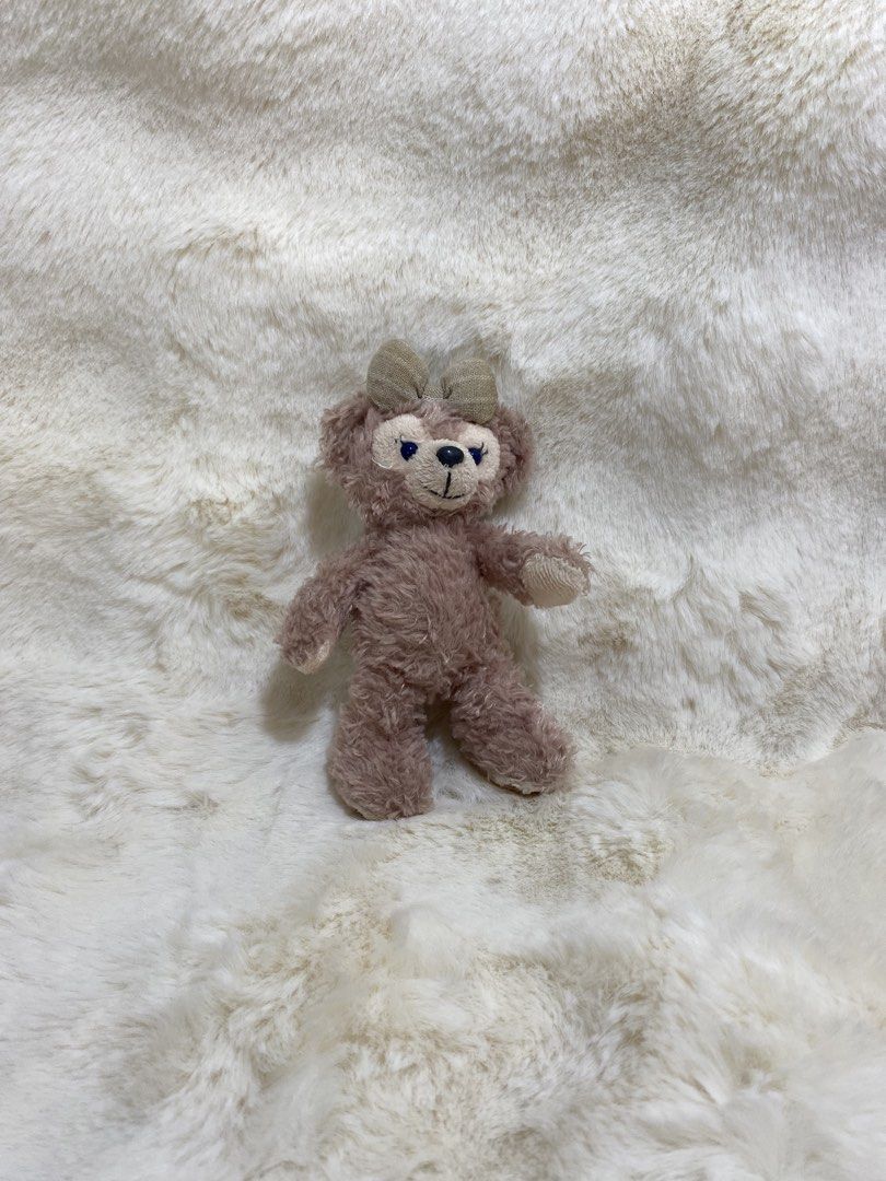 ShellieMay Bear Plush charm (Category: Plushies & Soft Toys) located in Kalibo. Submitted by ollie_stuffshop (Listing ID 1462899107, Image 1). Description: Before you send your inquiries: ❗️Last Price is already posted ❗️Manage your expectations, WYSIWYG ❗️May need washing ❗️Dropoff is every Wednesday & Sunday - Adorable dusty pink bear plush toy - Features a cute bow on its head - Tag reads 'Sheeplana' - Soft and huggable fur - Approximately 5 i