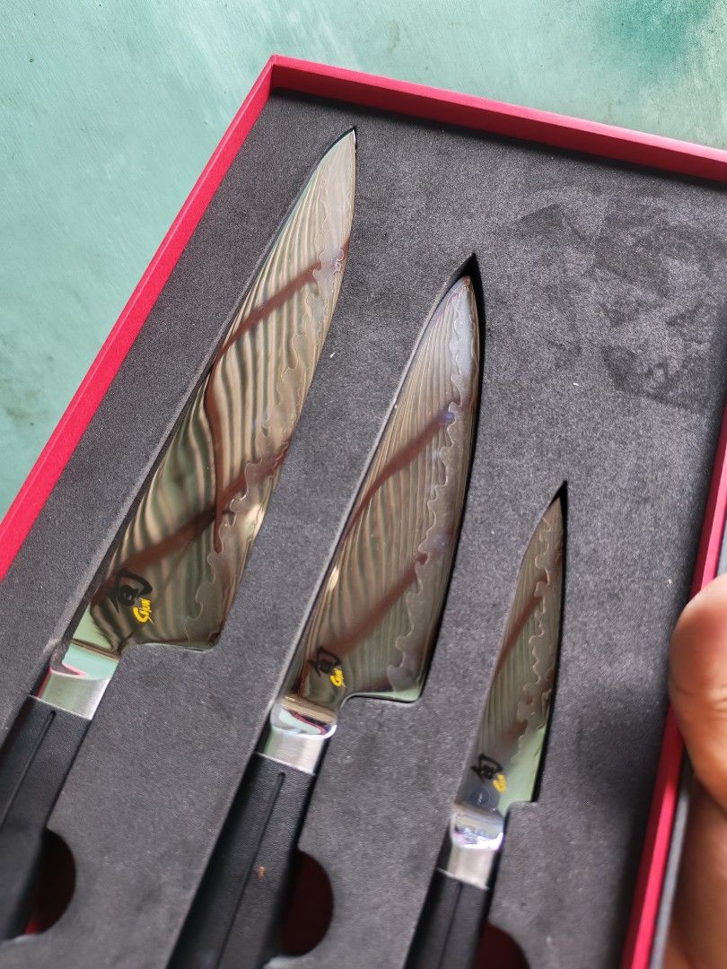 Shun Knife Set boxed unused❣️🫰 (Category: Knives & Chopping Boards) located in Daet. Submitted by jemotovlog28 (Listing ID 1462917980, Image 3). Description: - Shun 3-piece knife set - Set includes: Chef's Knife, Utility Knife, Paring Knife - Sleek black handles with silver accents - Comes in original Shun packaging - Elevate your culinary experience!.