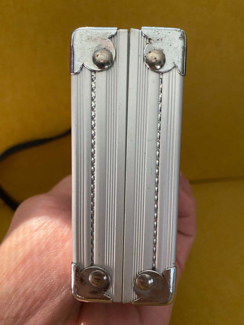 Silver Mini Hard Case Bag with Strap (Category: Cross-body Bags) located in Quezon City. Submitted by heybailey (Listing ID 1462947610, Image 3). Description: - Cool silver hard case bag - Textured finish - Detachable black strap - Ideal for small essentials (phone, cards) - Perfect for a night out.