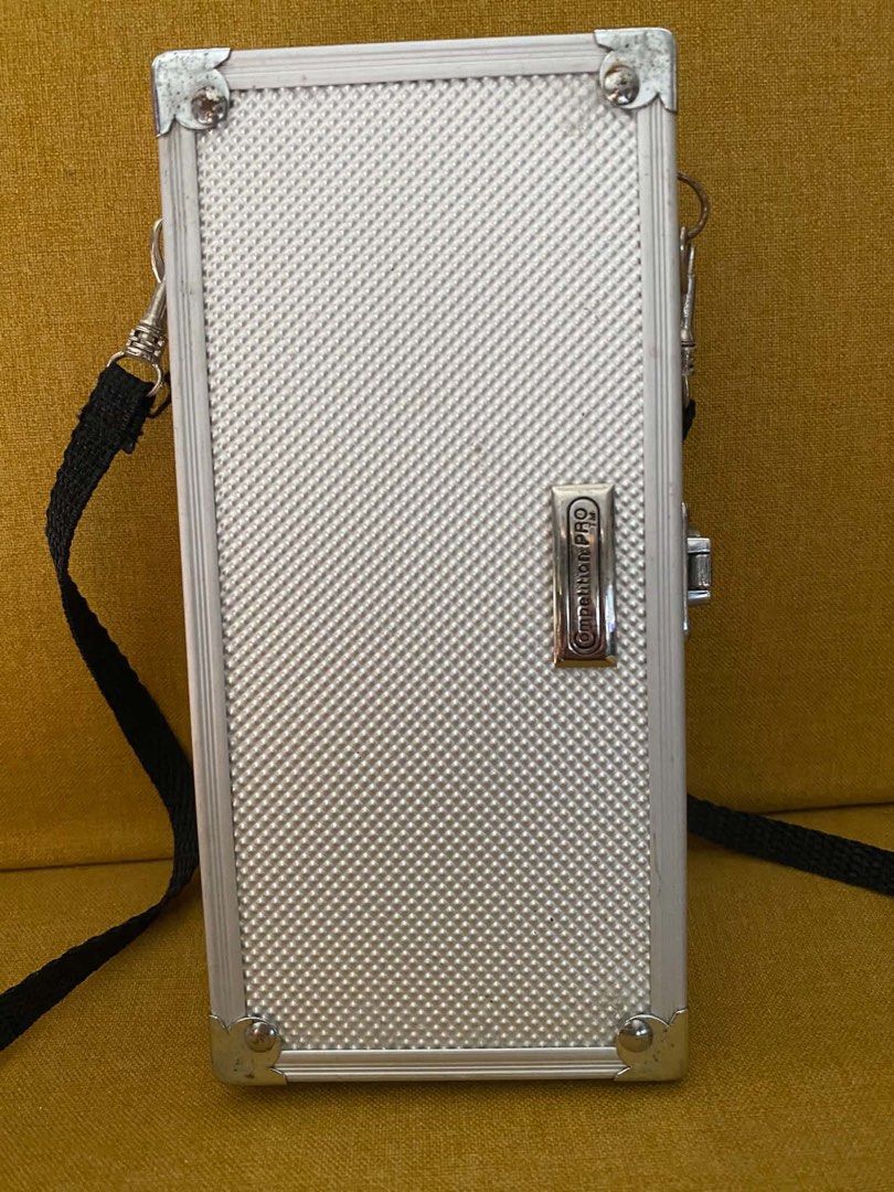 Silver Mini Hard Case Bag with Strap (Category: Cross-body Bags) located in Quezon City. Submitted by heybailey (Listing ID 1462947610, Image 2). Description: - Cool silver hard case bag - Textured finish - Detachable black strap - Ideal for small essentials (phone, cards) - Perfect for a night out.