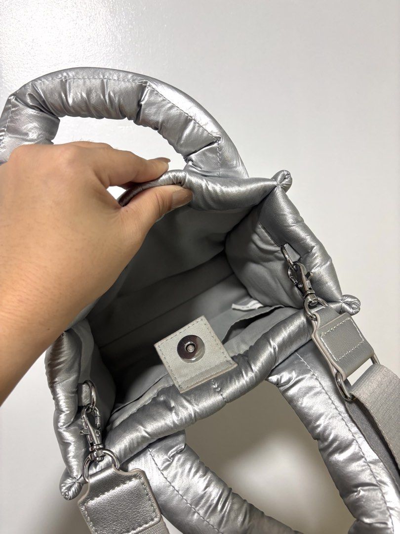 Silver Puffer Tote Bag with Shoulder Strap (Category: Tote Bags) located in Guiguinto. Submitted by 2nd.stuff. (Listing ID 1462896922, Image 3). Description: LAST PRICE POSTED! - Super cute silver puffer tote bag - Shiny, eye-catching material - Top handles and detachable shoulder strap - Magnetic snap closure - Spacious interior for essentials - Perfect for everyday or a night out.