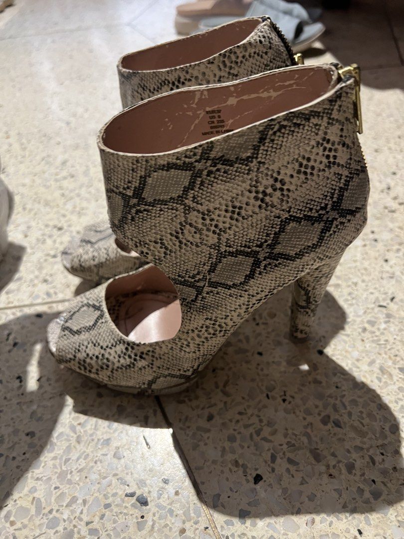 Snake Print Peep Toe Platform Heels with Zipper (Category: Heels) located in Manila. Submitted by cubbyhole525928 (Listing ID 1462907161, Image 2). Description: - Eye-catching snake print design - Trendy peep-toe style - Comfortable platform sole - Easy back zipper closure - A true statement piece to elevate your look.