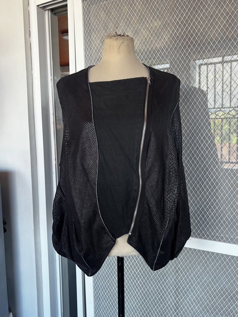 Snakeskin Asymmetrical Closure Vest (Category: Sleeveless) located in Apalit. Submitted by orchid555_ (Listing ID 1462944542, Image 2). Description: - Textured snake-skin like pattern - Asymmetrical zipper front - Sleeveless design - Unique stitching details - Drapes nicely.