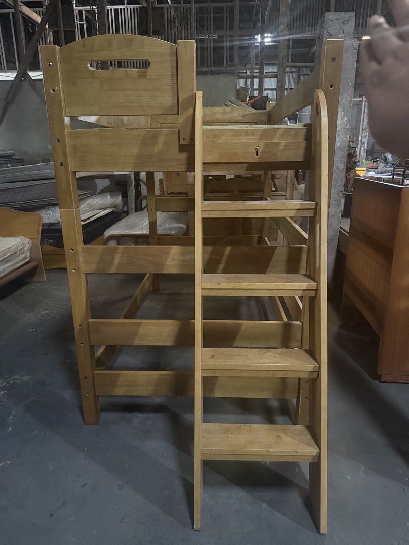 Solid Wood Twin Over Twin Bunk Bed with Ladder (Category: Bed Frames & Mattresses) located in Angeles City. Submitted by maryannmar33098 (Listing ID 1463039449, Image 2). Description: - Sturdy wooden bunk bed - Twin over twin size - Includes ladder for easy access - Bottom bunk comes with a mattress - Solid wood construction - Ideal for kids' rooms or guest rooms - Ready for its new home.