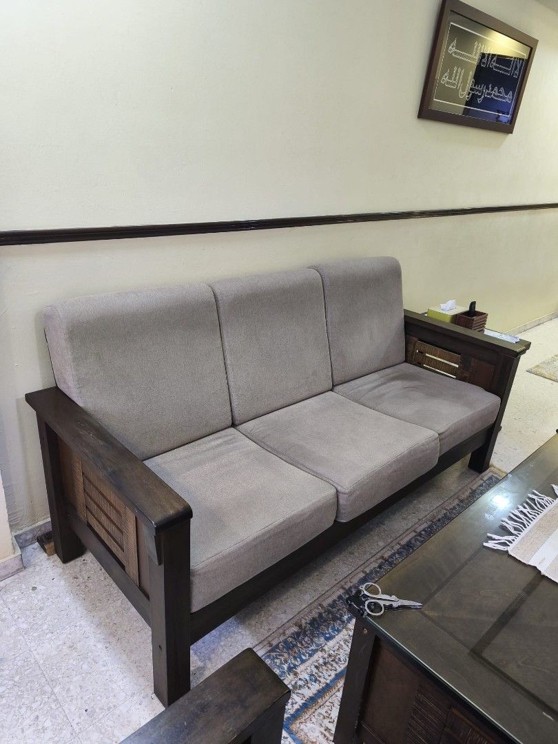Solid Wooden Sofa Set with Solid Coffee Table (Category: Sofas) located in Singapore. Submitted by clownzee (Listing ID 1462955002, Image 3). Description: Specs: Coffee Table: L120cm x W80cm x H46cm 3-seater Sofa: L178cm x W72cm x H80cm Armchair: L72cm x W72cm x 80cm - 3-seater sofa - 2 units of 1-seater armchair - Dark wood frame - Neutral fabric cushions - Solid Coffee table features glass top and lower shelf (heavy) - Sofa back secured with zi