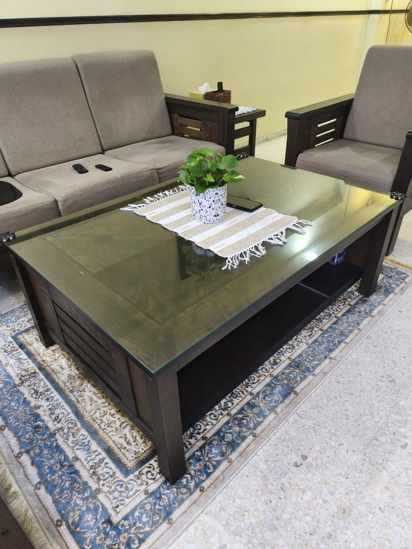Solid Wooden Sofa Set with Solid Coffee Table (Category: Sofas) located in Singapore. Submitted by clownzee (Listing ID 1462955002, Image 2). Description: Specs: Coffee Table: L120cm x W80cm x H46cm 3-seater Sofa: L178cm x W72cm x H80cm Armchair: L72cm x W72cm x 80cm - 3-seater sofa - 2 units of 1-seater armchair - Dark wood frame - Neutral fabric cushions - Solid Coffee table features glass top and lower shelf (heavy) - Sofa back secured with zi