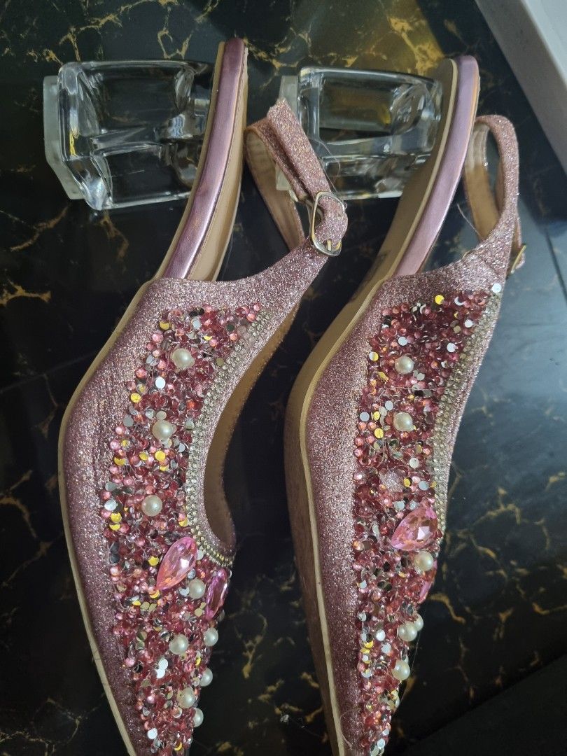 Sparkly Pink Slingback Heels with Gem Embellishments (Category: Heels) located in Quezon City. Submitted by stylextruck (Listing ID 1462912444, Image 2). Description: -use once only Eye-catching sparkly pink slingback heels - Adorned with rhinestones and pearls - Elegant pointed toe design - Chic clear block heel - Adjustable strap with buckle for a perfect fit - Ideal for parties, weddings, and special events.