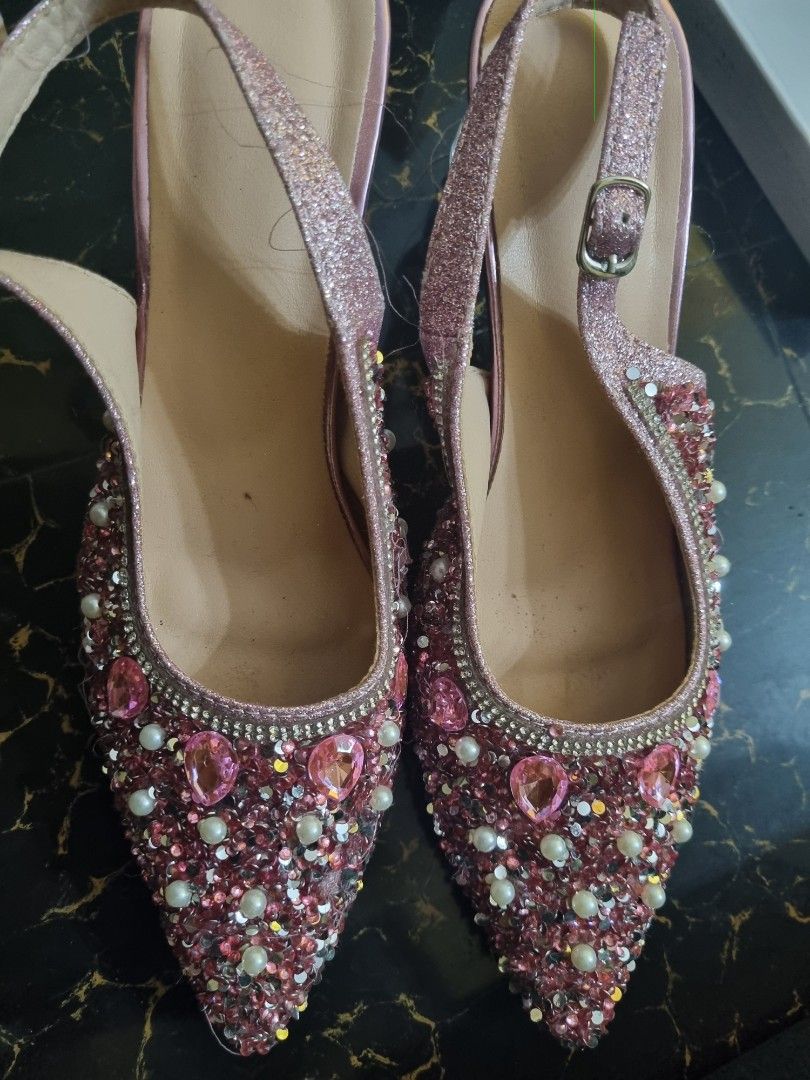 Sparkly Pink Slingback Heels with Gem Embellishments (Category: Heels) located in Quezon City. Submitted by stylextruck (Listing ID 1462912444, Image 1). Description: -use once only Eye-catching sparkly pink slingback heels - Adorned with rhinestones and pearls - Elegant pointed toe design - Chic clear block heel - Adjustable strap with buckle for a perfect fit - Ideal for parties, weddings, and special events.