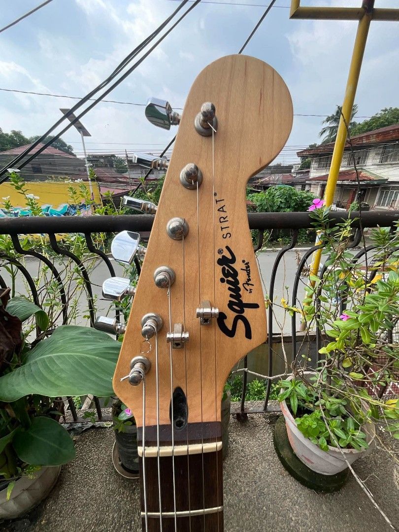 Squier by Fender Stratocaster Electric Guitar (Category: Musical Instruments) located in Caloocan City. Submitted by jhunixemberda-78114 (Listing ID 1463117216, Image 3). Description: - Black Squier Stratocaster by Fender - Tortoiseshell pickguard - Three single-coil pickups - Maple neck with rosewood fretboard - Chrome tuners - Crafted in Indonesia - Ideal for playing music.