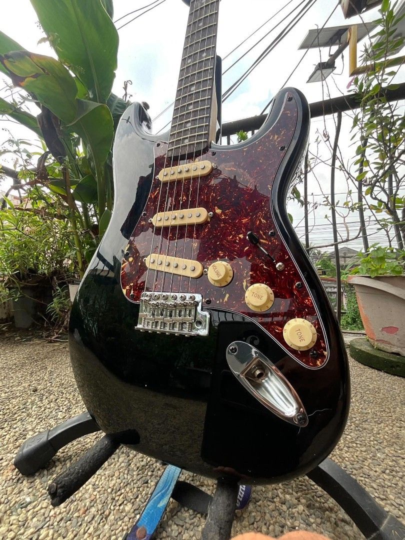 Squier by Fender Stratocaster Electric Guitar (Category: Musical Instruments) located in Caloocan City. Submitted by jhunixemberda-78114 (Listing ID 1463117216, Image 1). Description: - Black Squier Stratocaster by Fender - Tortoiseshell pickguard - Three single-coil pickups - Maple neck with rosewood fretboard - Chrome tuners - Crafted in Indonesia - Ideal for playing music.