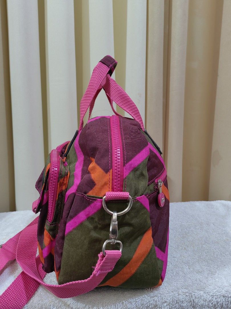 SSAMZIE Multi-color Nylon Shoulder Bag (Category: Shoulder Bags) located in Makati City. Submitted by prelovedtreatedwithlove (Listing ID 1463004630, Image 3). Description: - Cute multi-color nylon bag - Pink straps - Main zip compartment - Several front pockets - Detachable shoulder strap included - Ideal for everyday use or travel - Interior zip pocket - Approximate measurements: 12 inches wide x 8 inches tall - No issue like new -Kingpling Mat