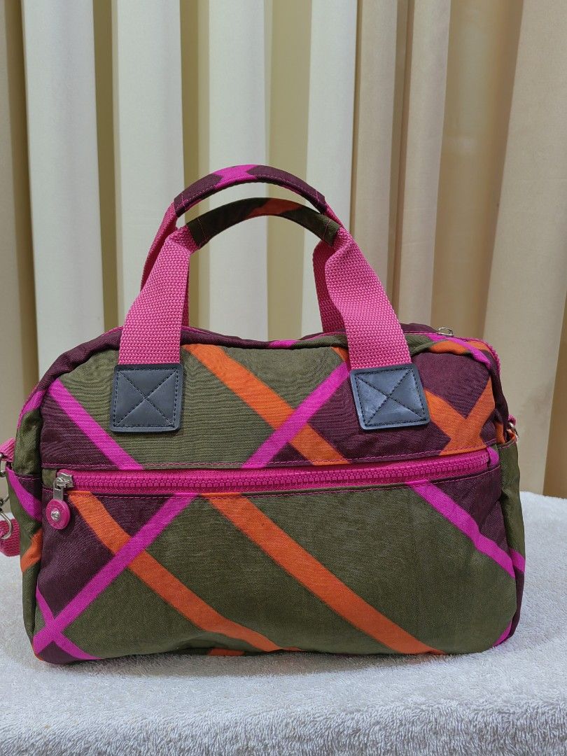 SSAMZIE Multi-color Nylon Shoulder Bag (Category: Shoulder Bags) located in Makati City. Submitted by prelovedtreatedwithlove (Listing ID 1463004630, Image 2). Description: - Cute multi-color nylon bag - Pink straps - Main zip compartment - Several front pockets - Detachable shoulder strap included - Ideal for everyday use or travel - Interior zip pocket - Approximate measurements: 12 inches wide x 8 inches tall - No issue like new -Kingpling Mat