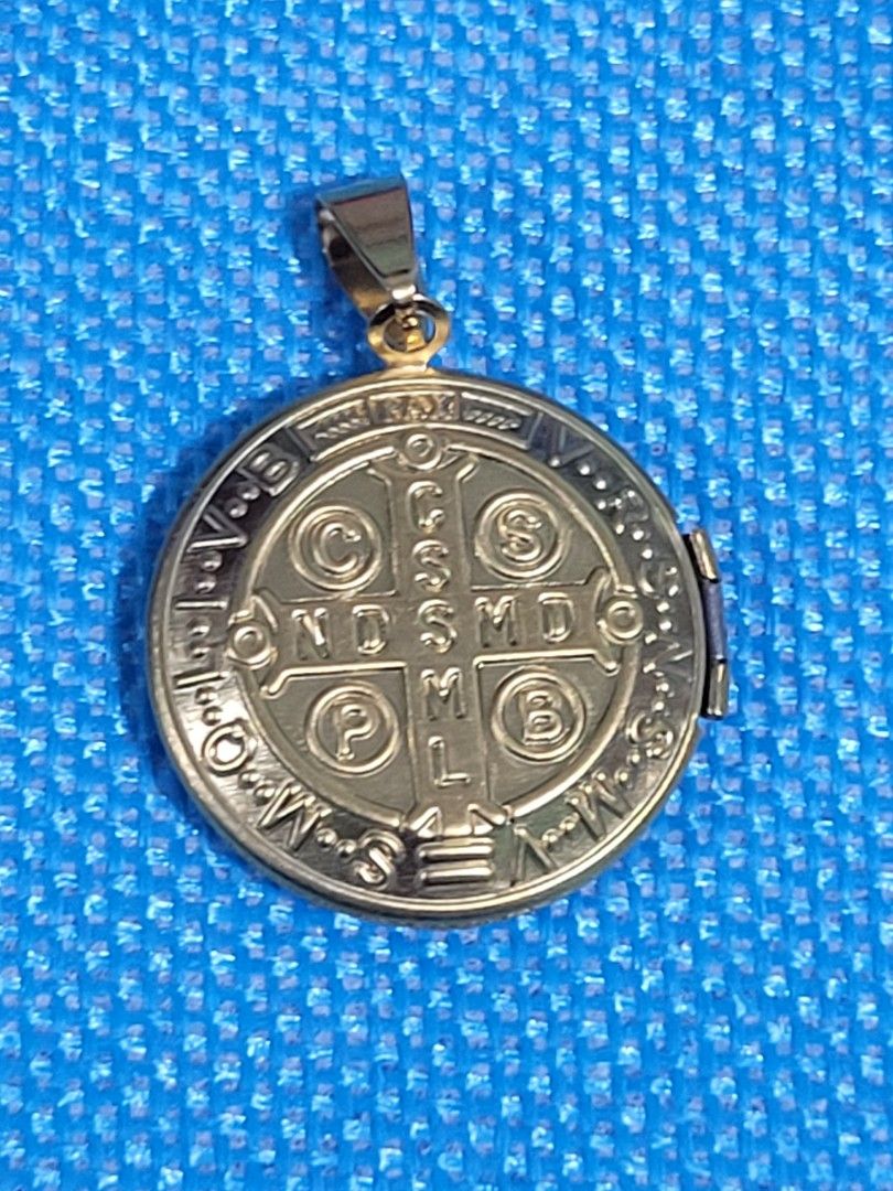 ST. BENEDICT LOCKET PENDANT AUTHENTIC STAINLESS GOLD BACK TO BACK DESIGN (Category: Religious Items) located in Makati City. Submitted by juriexpi (Listing ID 1462945133, Image 3). Description: ST. BENEDICT LOCKET PENDANT AUTHENTIC STAINLESS GOLD BACK TO BACK DESIGN brand new non tarnish stainless silver what you see is what you get comes with gift pouch as packaging.