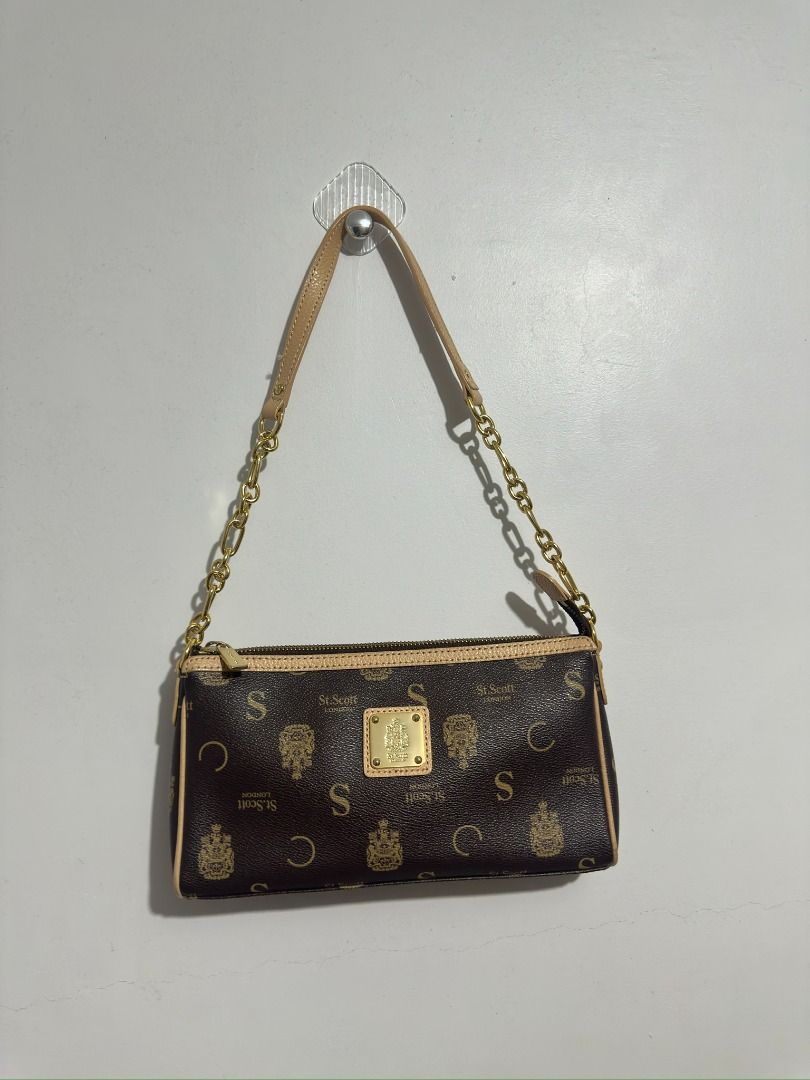 St. Scott London Monogram Shoulder Bag (Category: Luxury Bags & Wallets) located in Caloocan City. Submitted by 0hannahbanana (Listing ID 1462999562, Image 1). Description: - Brown St. Scott London monogram shoulder bag - Gold chain strap - Beige trim - Zip closure - Gold hardware detail on the front - Small and compact, ideal for essentials 💯 100% Authentic 👜 Pre-owned but in brand-new condition ✨ Excellent condition — no issues! ✅ No rubs ✅ N