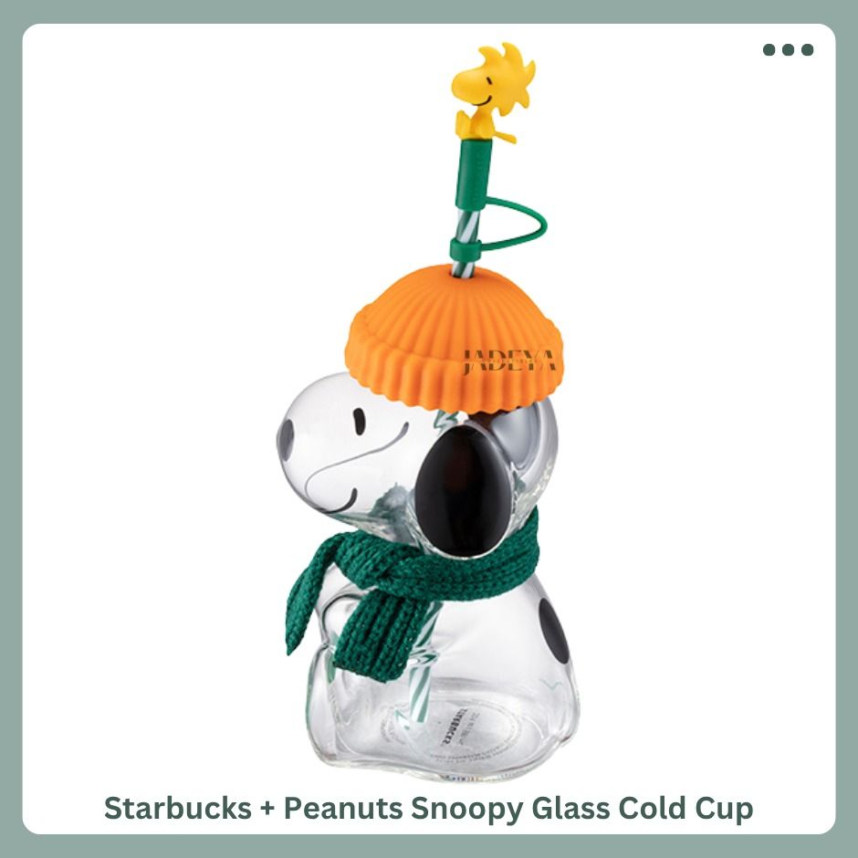 Starbucks + Peanuts Snoppy Glass Cold Cup (Category: Water Bottles & Tumblers) located in Mandaluyong City. Submitted by j4d3y4.collectibles (Listing ID 1463058688, Image 1). Description: Bring a little Peanuts personality to your daily coffee run. This 20oz glass cold cup features a playful character inspired design, complete with a decorative silicone hat topper, scarf detail and reusable straw. Made from borosilicate glass with a stainless ste