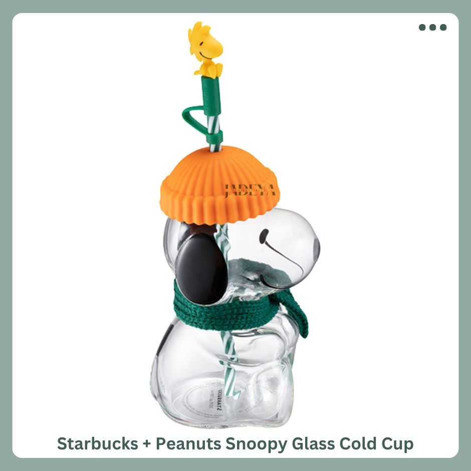 Starbucks + Peanuts Snoppy Glass Cold Cup (Category: Water Bottles & Tumblers) located in Mandaluyong City. Submitted by j4d3y4.collectibles (Listing ID 1463058688, Image 2). Description: Bring a little Peanuts personality to your daily coffee run. This 20oz glass cold cup features a playful character inspired design, complete with a decorative silicone hat topper, scarf detail and reusable straw. Made from borosilicate glass with a stainless ste