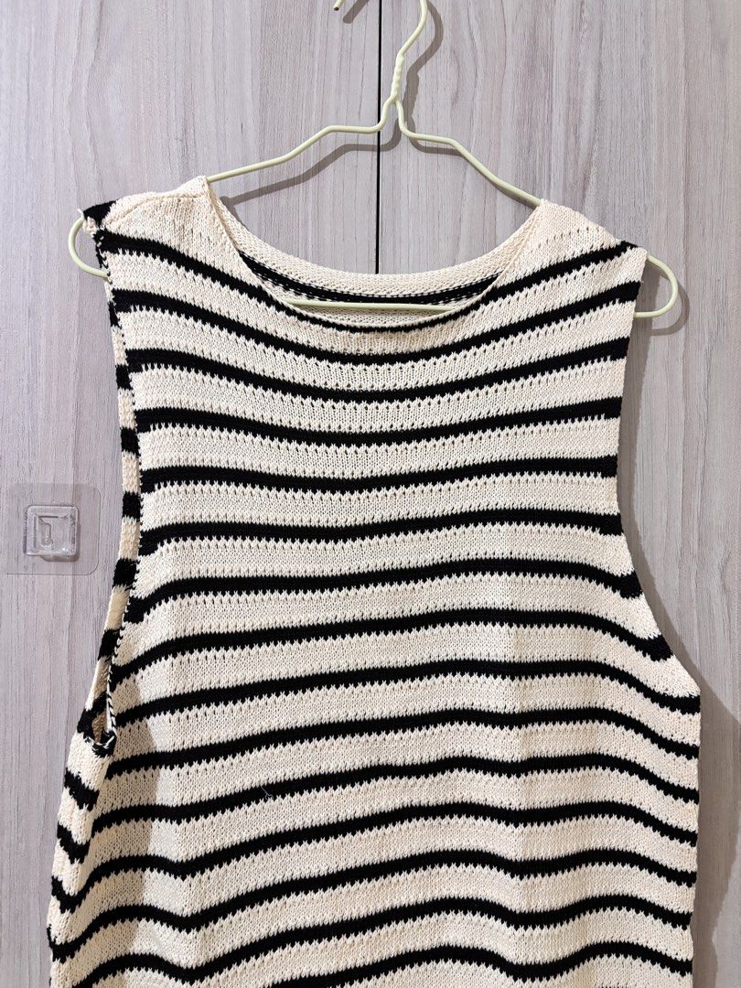 Striped Sleeveless Knit Top (Category: Sleeveless) located in Leyte. Submitted by modernpersephone (Listing ID 1463034630, Image 2). Description: - Cream and black striped sleeveless knit top - Comfortable crew neck design - Versatile for layering or wearing solo - Effortlessly pairs with jeans or shorts Best fit for S-M Condition: 7/10.