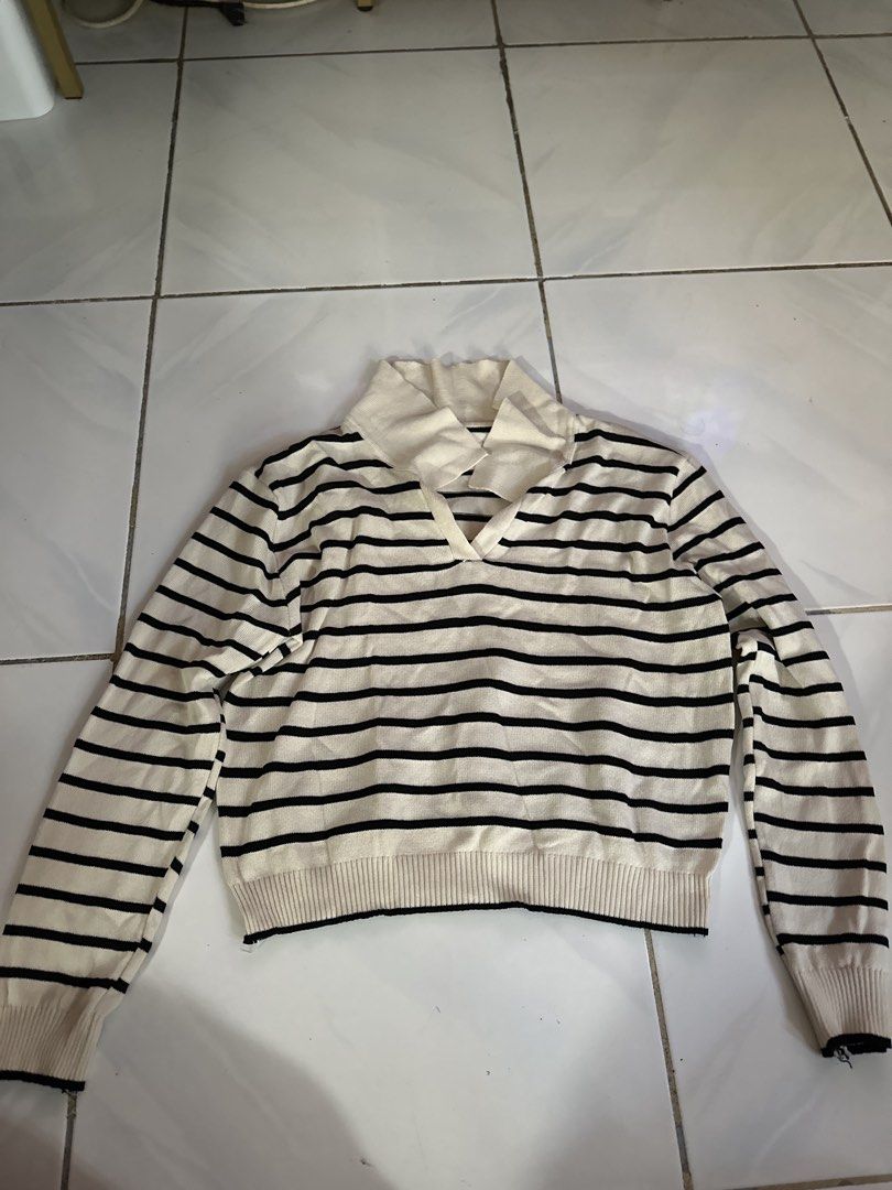 Striped V-neck Collar Sweater (Category: Longsleeves) located in Caloocan City. Submitted by triciacab (Listing ID 1462938320, Image 1). Description: - Cream and black striped design - V-neck collar - Long sleeves with ribbed cuffs - Comfortable and stylish - Ideal for casual outfits.