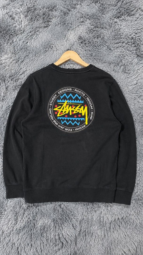 Stussy Black Crewneck Sweatshirt (Category: Coats, Jackets and Outerwear) located in Davao. Submitted by erwin_james (Listing ID 1463009755, Image 2). Description: - Black Stussy crewneck sweatshirt - Size: Small - Features circular graphic on front - Large graphic with Stussy branding and abstract patterns on back - Material: Cotton blend - Ideal for casual wear -DIMENSION:21x27.