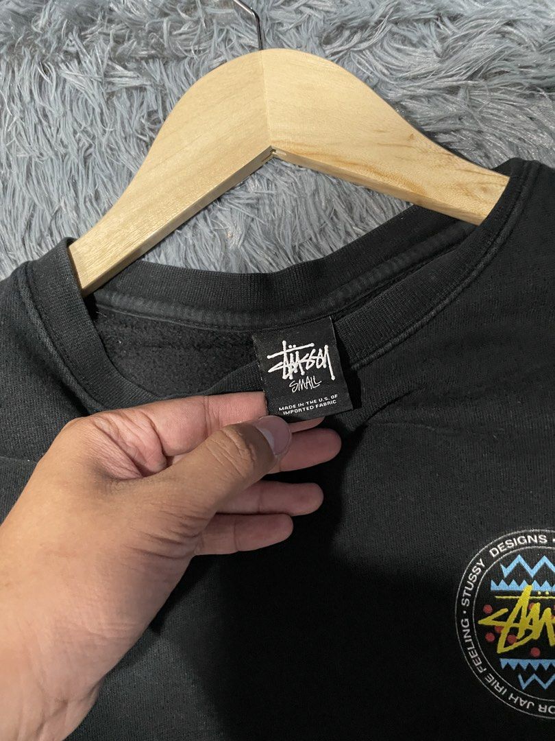 Stussy Black Crewneck Sweatshirt (Category: Coats, Jackets and Outerwear) located in Davao. Submitted by erwin_james (Listing ID 1463009755, Image 3). Description: - Black Stussy crewneck sweatshirt - Size: Small - Features circular graphic on front - Large graphic with Stussy branding and abstract patterns on back - Material: Cotton blend - Ideal for casual wear -DIMENSION:21x27.