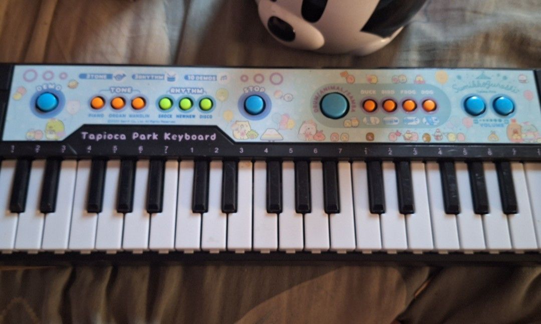 Sumikko Gurashi – Tapioca Park Electronic Keyboard (Category: Musical Instruments) located in Paombong. Submitted by revox.store (Listing ID 1462901343, Image 1). Description: San-X • Sumikko Gurashi • Electronic Keyboard Included: ✓ Tapioca Park mini electronic keyboard unit ✓ Battery compartment cover with screw Flaws: • Small hairline crack on rear plastic casing Description: • Fully working sound unit with instrument tones, rhythm beats, and 