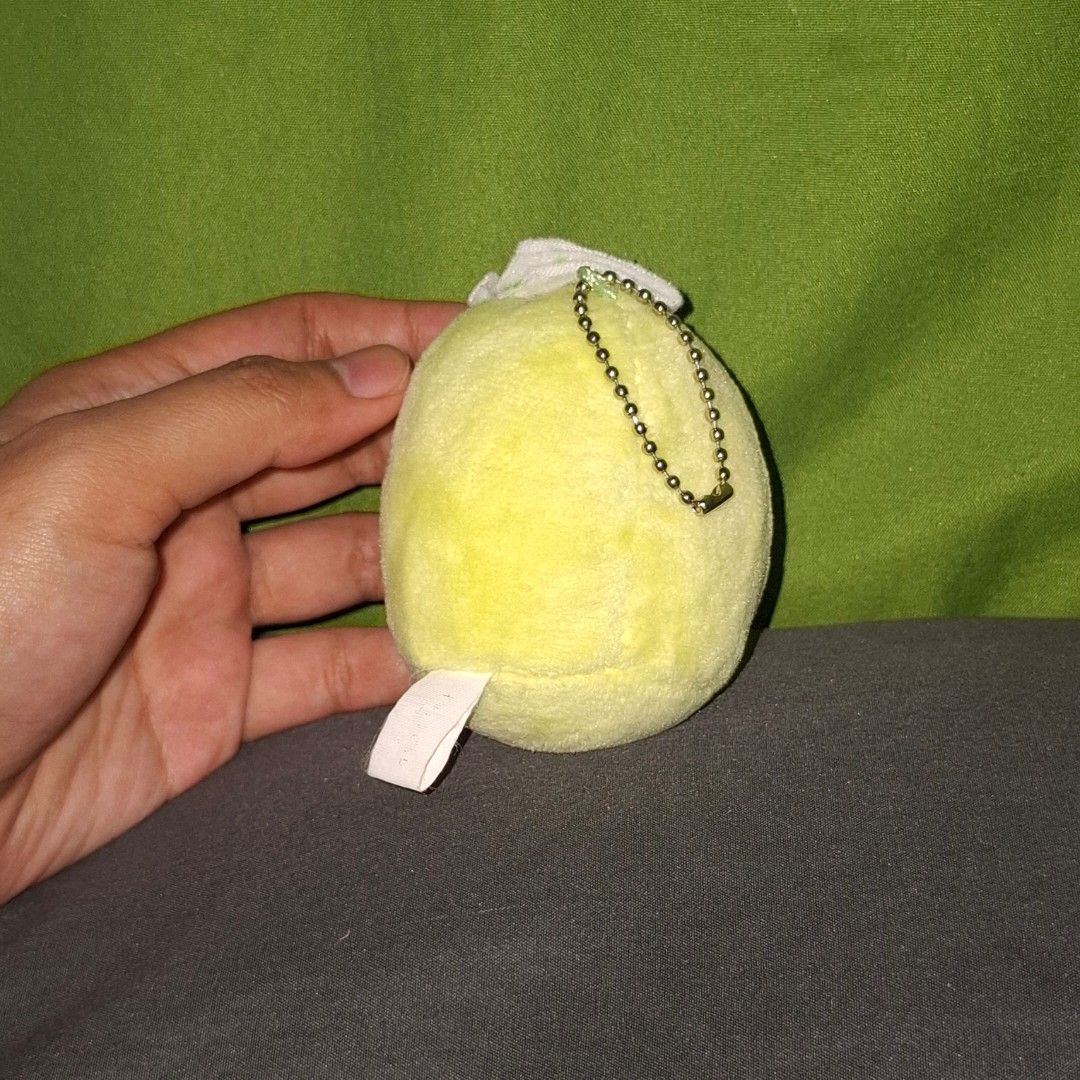 Sumikko Gurashi Penguin? tenori charm (Category: Plushies & Soft Toys) located in Adams. Submitted by frog_and_clover (Listing ID 1463040662, Image 2). Description: sumikko Gurashi Penguin relaxing spa-style green cucumber slice resting on a white towel headband. no issue. what you see is what you get.