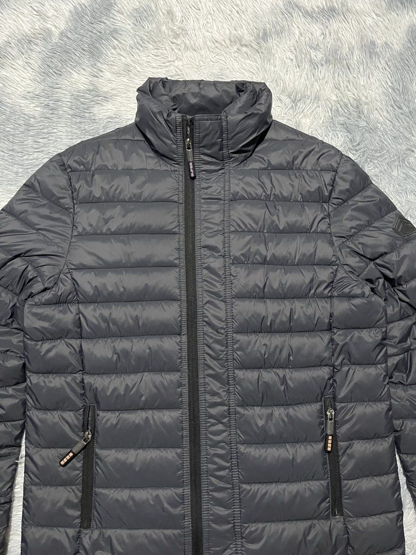 Superdry Triple Zip Puffer Jacket (Category: Coats, Jackets and Outerwear) located in Sasmuan (Sexmoan). Submitted by winterclothes.ph (Listing ID 1462891766, Image 2). Description: Superdry Triple Zip Puffer Jacket L on tag Width 22.5 Length 27 Excellent Condition .