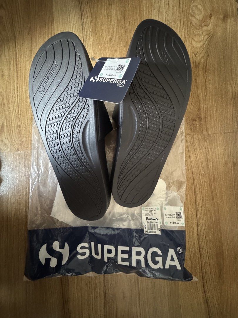 Superga Black Slides with Logo (Category: Slippers and slides) located in Taguig. Submitted by misstangerine (Listing ID 1462950974, Image 2). Description: - Authentic Superga slides in classic black. - Features the iconic Superga logo across the strap. - Designed with a wavy patterned sole for enhanced grip. - Brand new and comes in its original packaging. - Recently purchased..