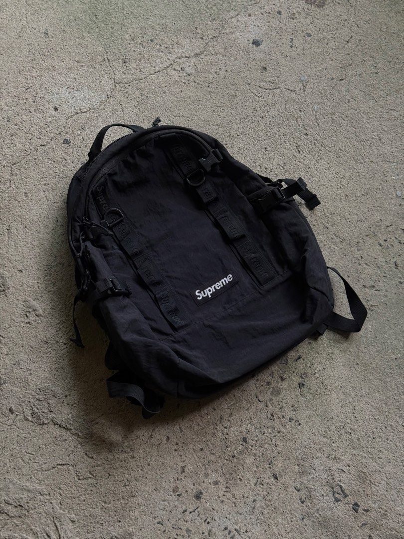 Supreme Black Backpack (Category: Backpacks) located in Manila. Submitted by yamborghini22 (Listing ID 1462986919, Image 2). Description: - Authentic Supreme backpack - Made in Vietnam - Multiple straps and buckles for secure storage - Wide-opening main compartment for easy access - Internal zip pocket for small essentials - Padded back panel for comfortable carrying - Ideal for everyday use.