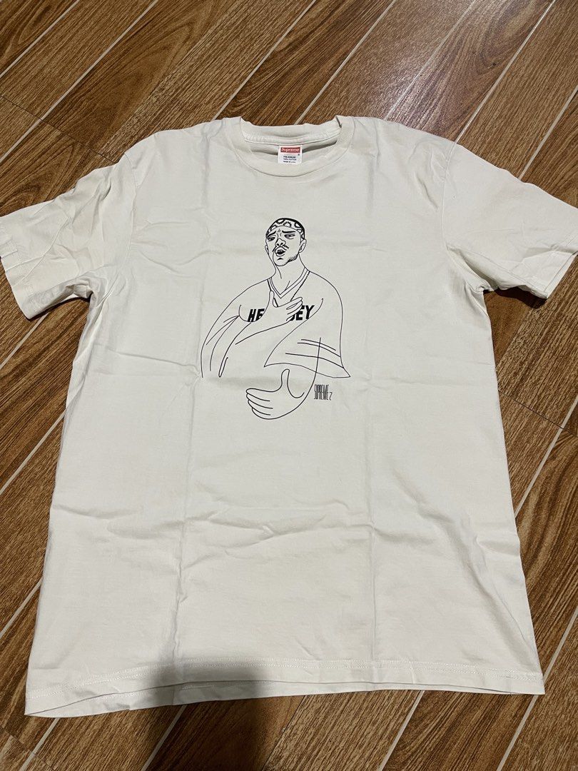 Supreme Graphic T-Shirt Size M (Category: Tshirts & Polo Shirts ) located in Mandaluyong City. Submitted by mark2pac (Listing ID 1462906119, Image 1). Description: - White Supreme graphic tee - Features a unique line art design on the front - Made from 100% pre-shrunk cotton for a comfortable, lasting fit - Size: Medium - Proudly Made in USA - Ideal for everyday casual wear.