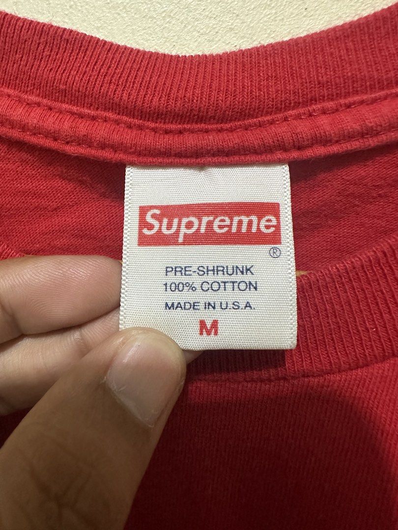 Supreme Red Box Logo T-Shirt Size M (Category: Tshirts & Polo Shirts ) located in Tagum. Submitted by ritarits572 (Listing ID 1463054914, Image 3). Description: - Red Supreme T-shirt - Features iconic Box Logo design - Made from 100% premium cotton - Pre-shrunk fabric for a consistent fit - Size: Medium, 20.5 x 27 - Proudly Made in the USA - Essential addition to any streetwear enthusiast's wardrobe - Flaws: bleach stains .