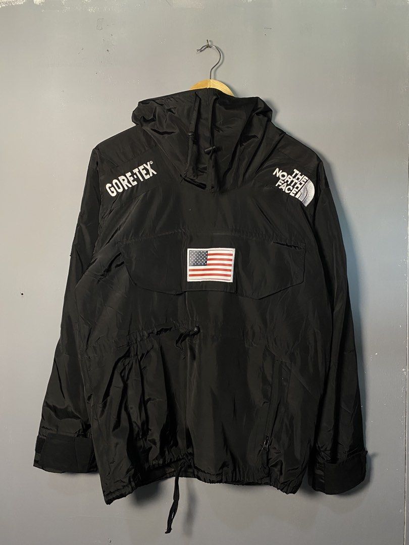 Supreme The North Face Gore-Tex Jacket (Category: Coats, Jackets and Outerwear) located in Caloocan City. Submitted by retrowear.gallery (Listing ID 1463013697, Image 1). Description: - Supreme x The North Face collaboration - Black Gore-Tex jacket - Iconic American flag patch on the back - Adjustable drawstring hood and waist - Perfect for staying dry in any weather - Stylish and functional design.