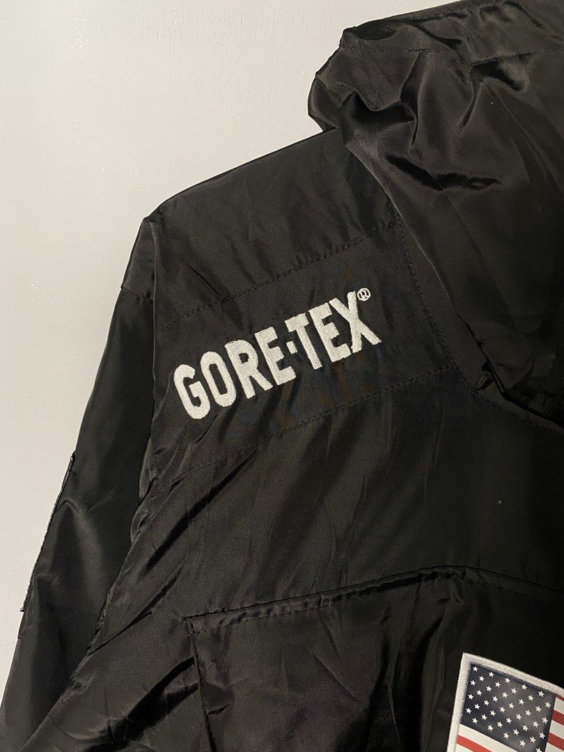Supreme The North Face Gore-Tex Jacket (Category: Coats, Jackets and Outerwear) located in Caloocan City. Submitted by retrowear.gallery (Listing ID 1463013697, Image 3). Description: - Supreme x The North Face collaboration - Black Gore-Tex jacket - Iconic American flag patch on the back - Adjustable drawstring hood and waist - Perfect for staying dry in any weather - Stylish and functional design.