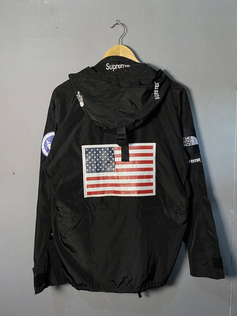 Supreme The North Face Gore-Tex Jacket (Category: Coats, Jackets and Outerwear) located in Caloocan City. Submitted by retrowear.gallery (Listing ID 1463013697, Image 2). Description: - Supreme x The North Face collaboration - Black Gore-Tex jacket - Iconic American flag patch on the back - Adjustable drawstring hood and waist - Perfect for staying dry in any weather - Stylish and functional design.