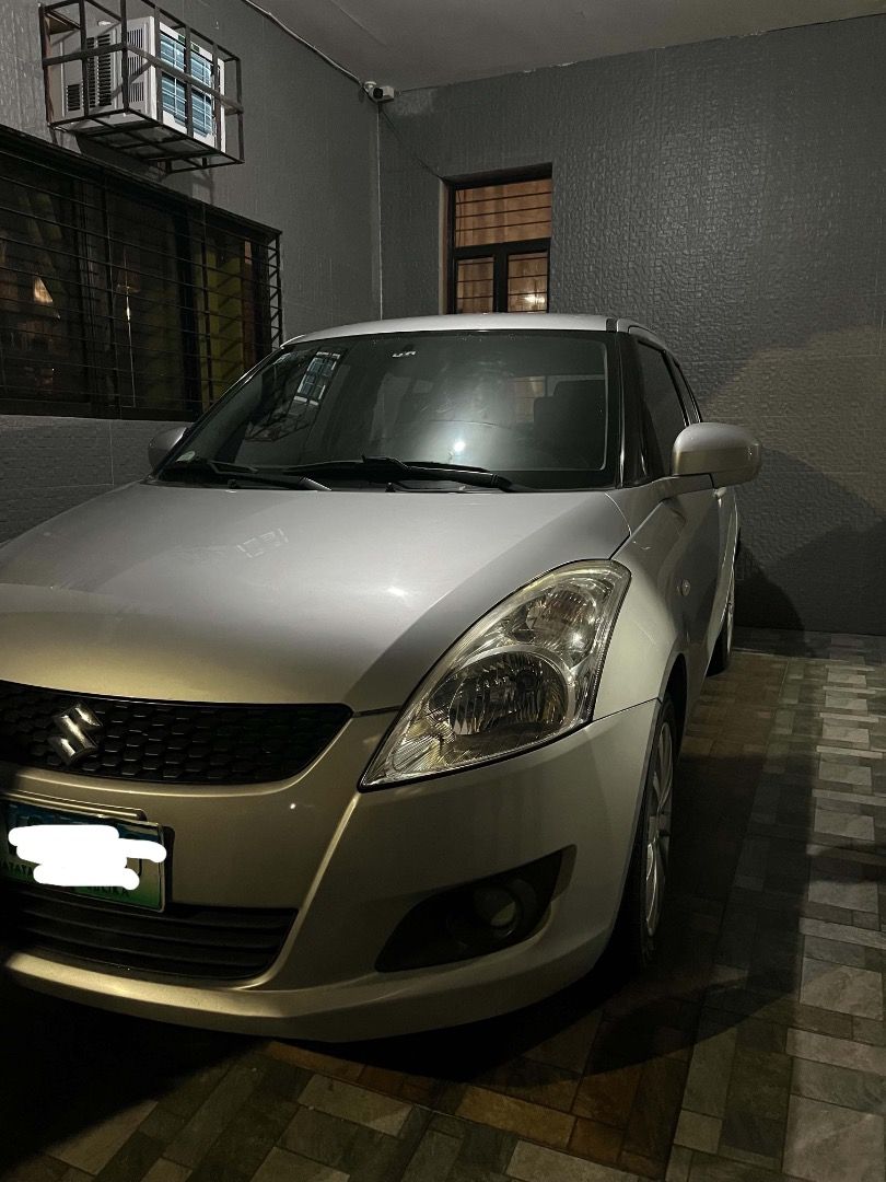 Suzuki Swift 1.4 5-Dr Plus Manual (Category: Used Cars) located in Manila. Submitted by hwnrsa_8032 (Listing ID 1463072852, Image 1). Description: FOR SALE: 2013 Suzuki Swift 1.4 Manual (Japan-Built) 🇯🇵 UNIT DETAILS: Year: 2013 Model: Suzuki Swift 1.4 5-Door Plus Engine: 1.4L Transmission: Manual Mileage: 57,238 km only Origin: Japan-built (Not a local unit) Registration: Registered until next year Air-con: Ice-cold ❄️ Head Unit: Android unit i