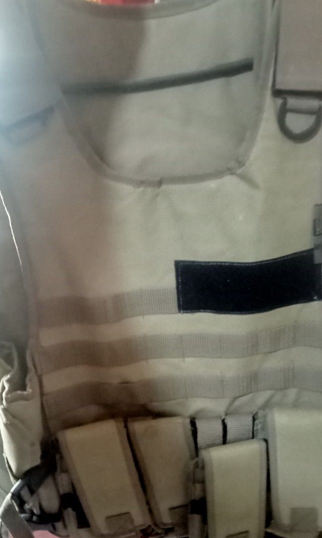 Tactical Vest with Pouches (Category: Vests) located in Paranaque City. Submitted by dimaguilaa94969 (Listing ID 1452924580, Image 1). Description: - Tan tactical vest - Multiple pouches on the front for gear storage - Reflective stripes for visibility - Adjustable straps for a customized fit - Ideal for outdoor activities and airsoft games.